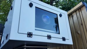 Outdoor projector enclosures