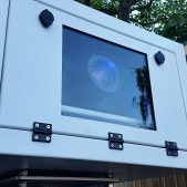 Outdoor projector enclosures
